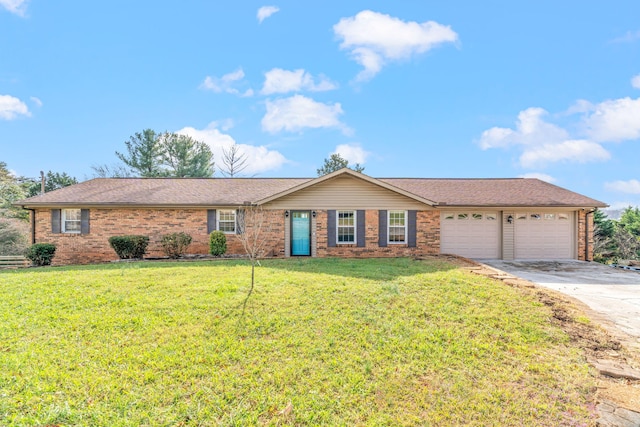 single story home with a garage and a front lawn