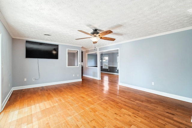 unfurnished living room with light hardwood / wood-style flooring, ceiling fan, and ornamental molding