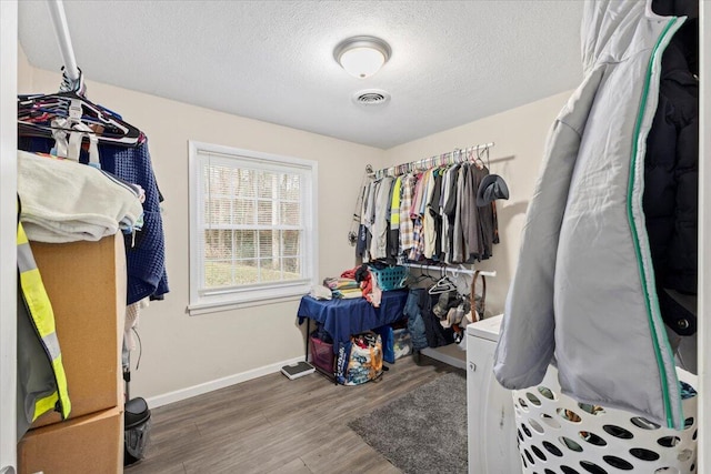 spacious closet featuring hardwood / wood-style floors