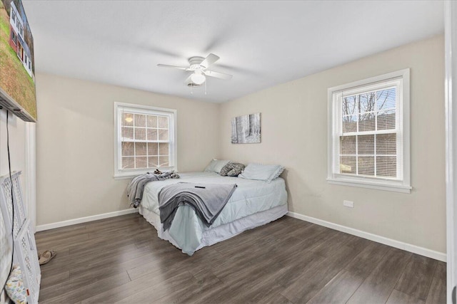 bedroom featuring dark hardwood / wood-style floors and ceiling fan