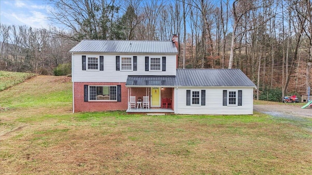 front facade featuring a porch and a front lawn