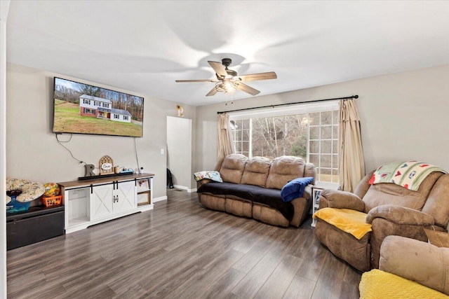 living room with ceiling fan and dark hardwood / wood-style flooring