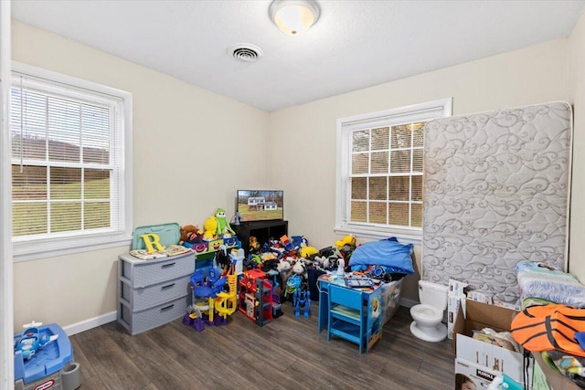 game room with dark wood-type flooring