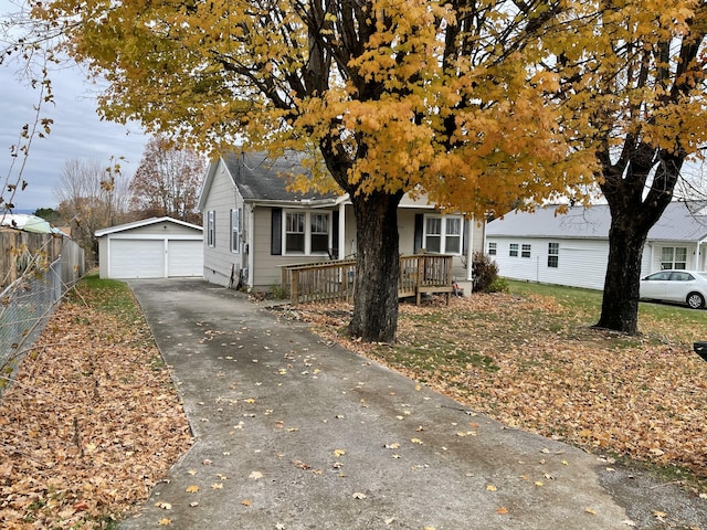 view of front facade with a garage and an outbuilding