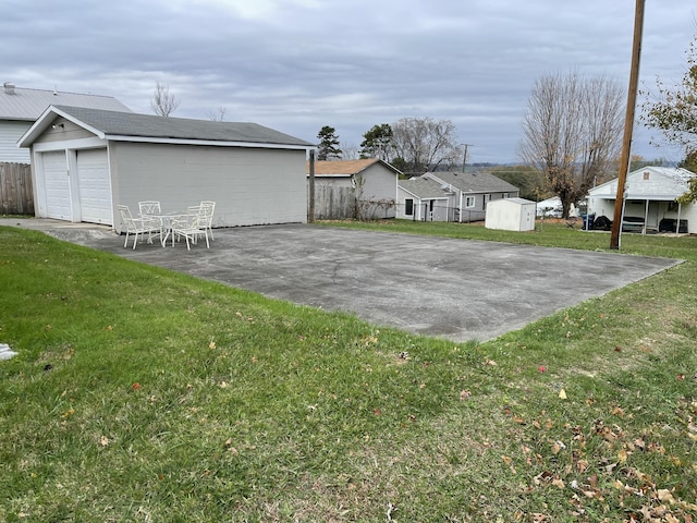 view of yard featuring an outbuilding and a patio area