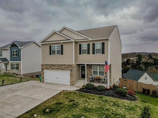 view of front of home with a garage and a front yard