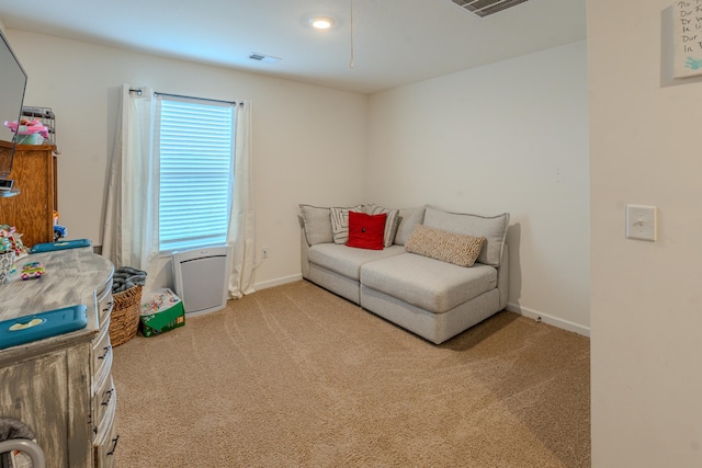 living area with light carpet