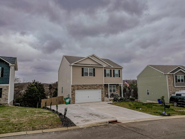 view of front of house featuring a garage and a front yard