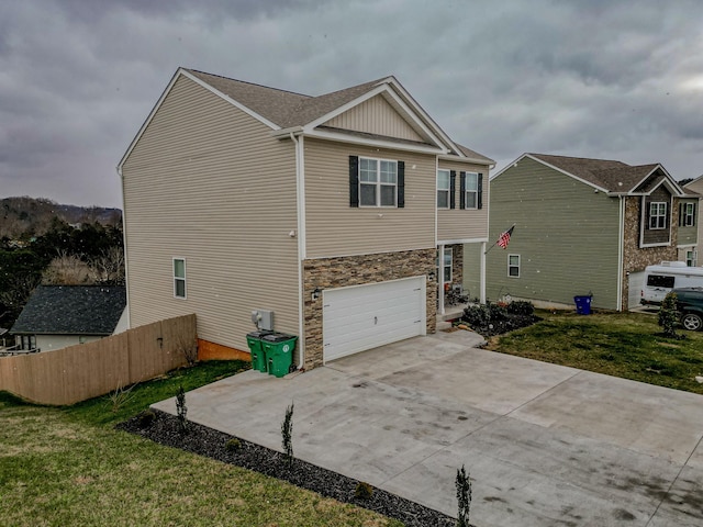 view of home's exterior featuring a yard and a garage