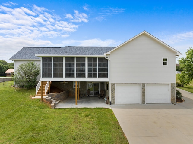 1114 Lake Ridge Dr, Dandridge, TN 37725 - rear view of property featuring a sunroom, stone siding, a garage, and a yard