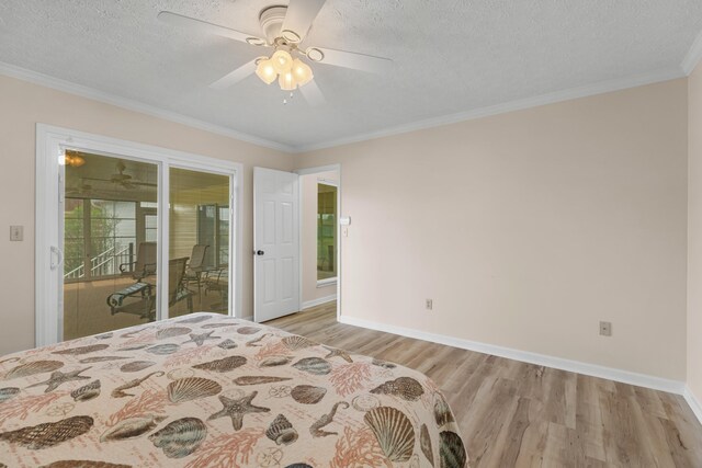 1114 Lake Ridge Dr, Dandridge, TN 37725 - bedroom featuring light wood-style flooring, a textured ceiling, ornamental molding, baseboards, and ceiling fan