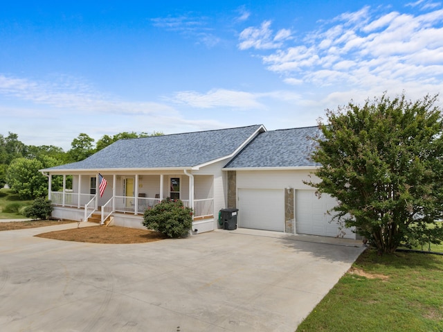 1114 Lake Ridge Dr, Dandridge, TN 37725 - view of front facade with covered porch, a garage, a shingled roof, and concrete driveway