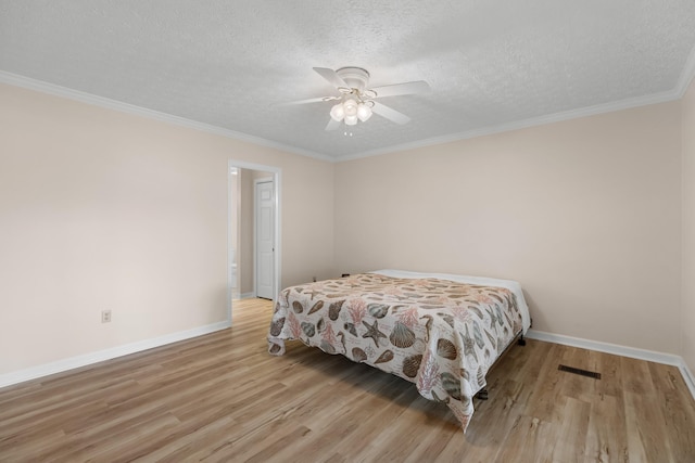 1114 Lake Ridge Dr, Dandridge, TN 37725 - bedroom with light wood finished floors, baseboards, a textured ceiling, ornamental molding, and a ceiling fan