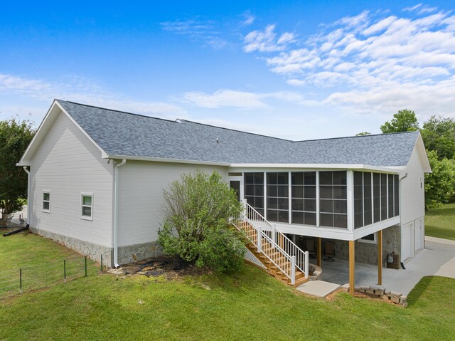 1114 Lake Ridge Dr, Dandridge, TN 37725 - rear view of property featuring a patio area, a sunroom, a shingled roof, stairway, and stone siding