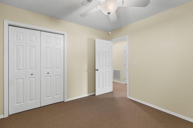 1114 Lake Ridge Dr, Dandridge, TN 37725 - unfurnished bedroom with dark carpet, baseboards, a closet, and a ceiling fan