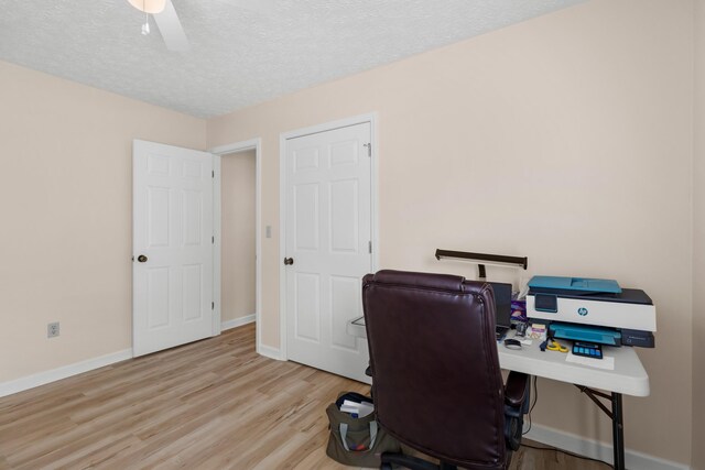 1114 Lake Ridge Dr, Dandridge, TN 37725 - home office featuring wood finished floors, baseboards, and a textured ceiling