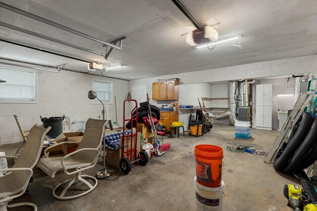 1114 Lake Ridge Dr, Dandridge, TN 37725 - garage with a garage door opener, heating unit, and concrete block wall