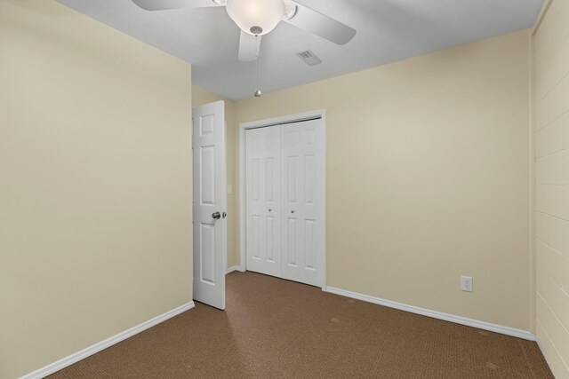 1114 Lake Ridge Dr, Dandridge, TN 37725 - unfurnished bedroom with dark colored carpet, a closet, baseboards, and ceiling fan