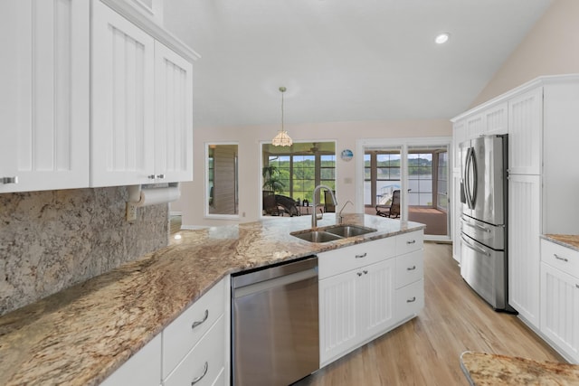 1114 Lake Ridge Dr, Dandridge, TN 37725 - kitchen featuring stainless steel appliances, a sink, lofted ceiling, decorative backsplash, and white cabinets
