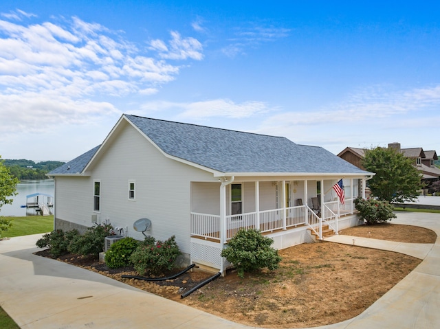 1114 Lake Ridge Dr, Dandridge, TN 37725 - view of front of property featuring covered porch, a shingled roof, and concrete driveway