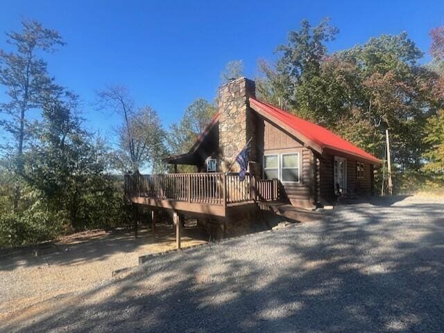 view of home's exterior featuring a wooden deck