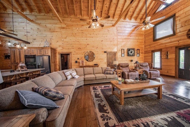 living room featuring beamed ceiling, wood-type flooring, high vaulted ceiling, and wood ceiling