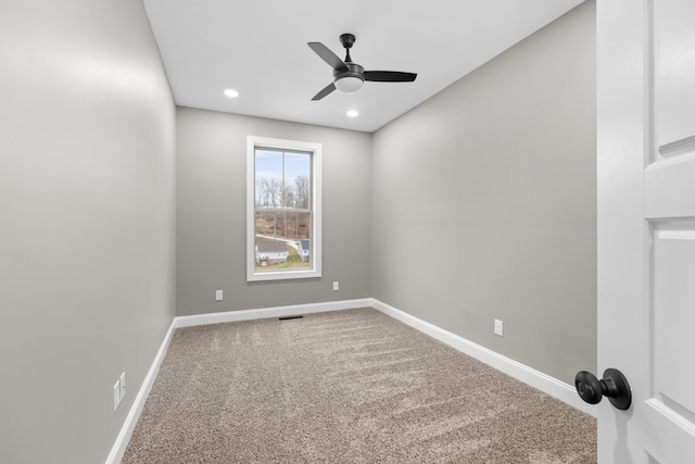 spare room with carpet flooring and ceiling fan