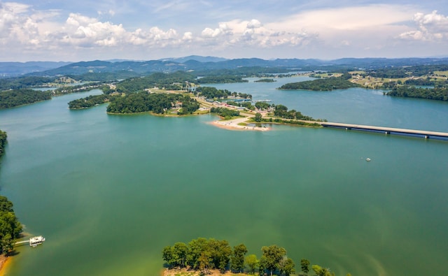 drone / aerial view with a water and mountain view