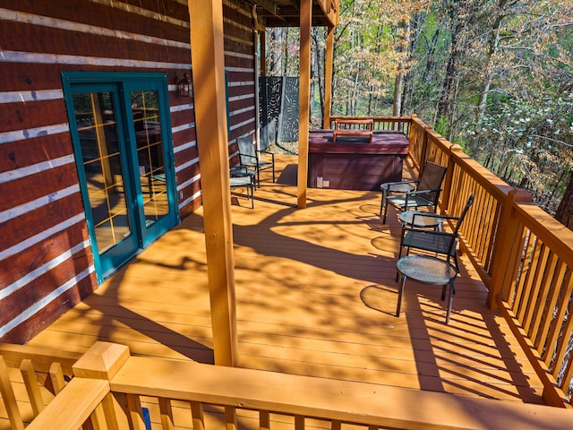 deck featuring a hot tub