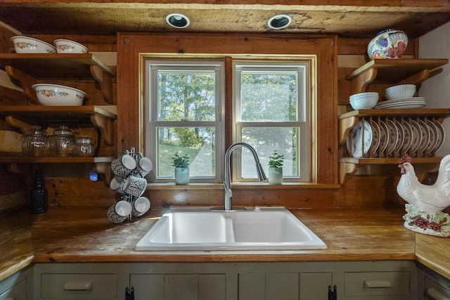 kitchen featuring wooden counters and sink