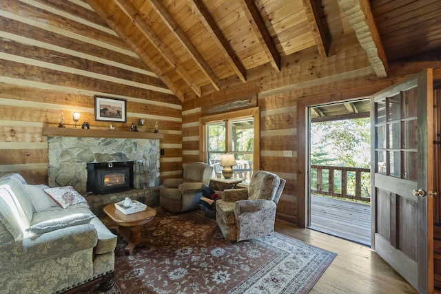 living room featuring beam ceiling, wooden ceiling, light hardwood / wood-style flooring, high vaulted ceiling, and wooden walls