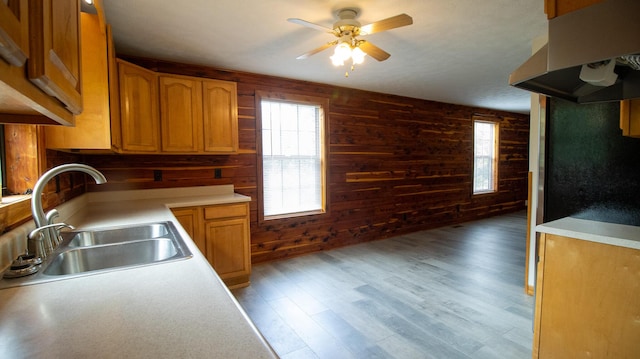 158 Delph Ln, Mooresburg, TN 37811 - kitchen with range hood, a ceiling fan, wood walls, light countertops, and light wood-style floors