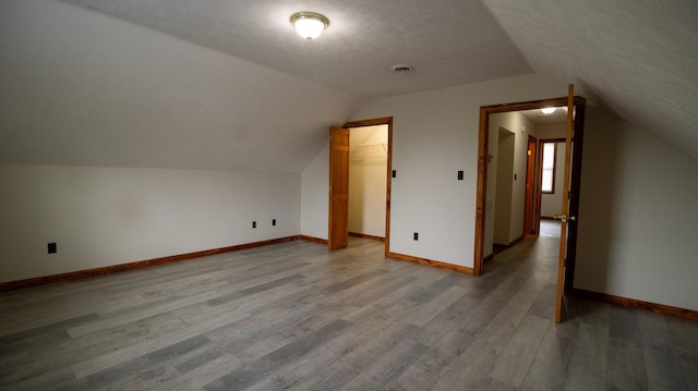 158 Delph Ln, Mooresburg, TN 37811 - additional living space featuring wood finished floors, lofted ceiling, and a textured ceiling