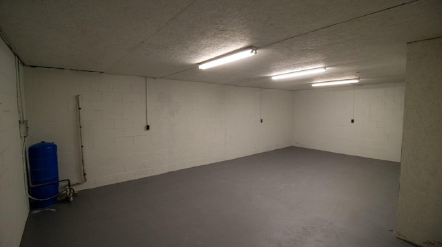 158 Delph Ln, Mooresburg, TN 37811 - finished basement with a water pressure tank, concrete block wall, and a textured ceiling