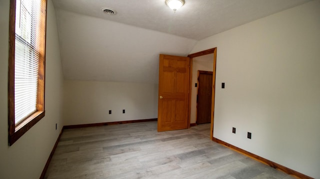 158 Delph Ln, Mooresburg, TN 37811 - empty room featuring lofted ceiling, healthy amount of natural light, and light wood-style floors