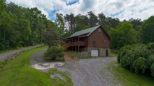 158 Delph Ln, Mooresburg, TN 37811 - view of property exterior featuring log exterior, driveway, a garage, stone siding, and stairway