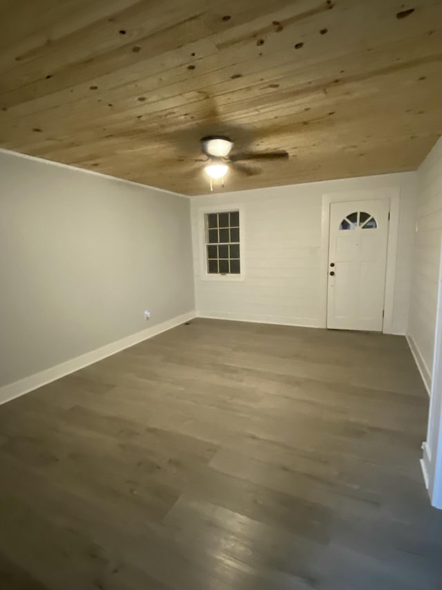 spare room with hardwood / wood-style flooring, ceiling fan, and wooden ceiling