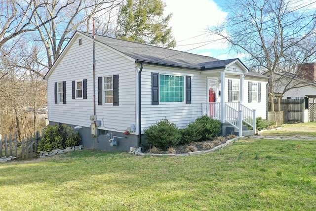 ranch-style home featuring a front yard