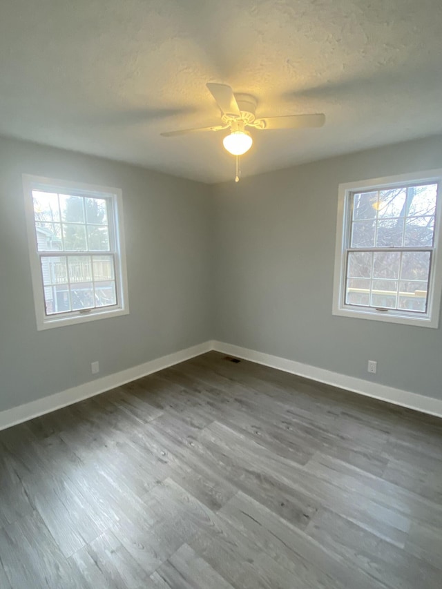 spare room featuring ceiling fan, a textured ceiling, and hardwood / wood-style floors