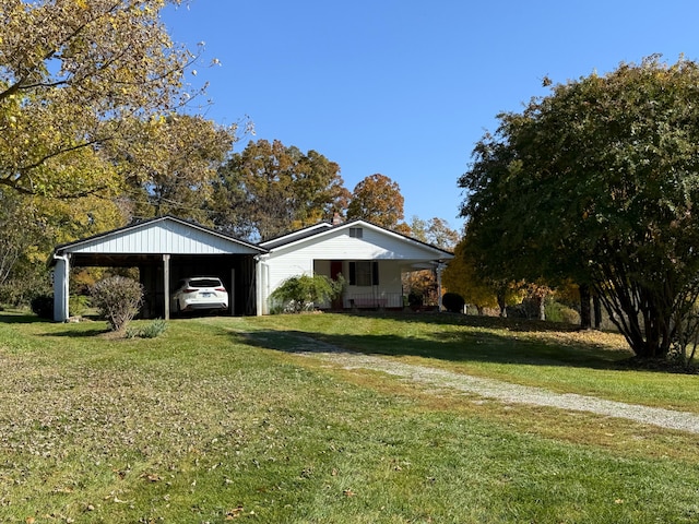 view of front facade featuring a front yard and a carport