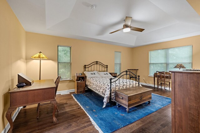 117 Tahlequah Ln, Loudon, TN 37774 - bedroom with a raised ceiling, dark wood-type flooring, baseboards, a ceiling fan, and a desk