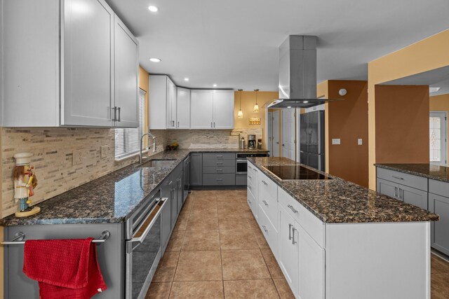 117 Tahlequah Ln, Loudon, TN 37774 - kitchen with island exhaust hood, a sink, a kitchen island, black electric cooktop, and fridge