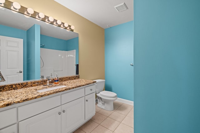 117 Tahlequah Ln, Loudon, TN 37774 - bathroom featuring vanity, toilet, tile patterned floors, baseboards, and a shower
