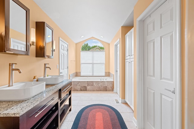 117 Tahlequah Ln, Loudon, TN 37774 - bathroom with a bath, double vanity, lofted ceiling, tile patterned floors, and recessed lighting