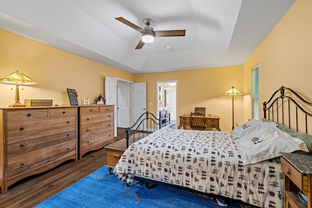 117 Tahlequah Ln, Loudon, TN 37774 - bedroom with a raised ceiling, wood finished floors, a ceiling fan, and connected bathroom