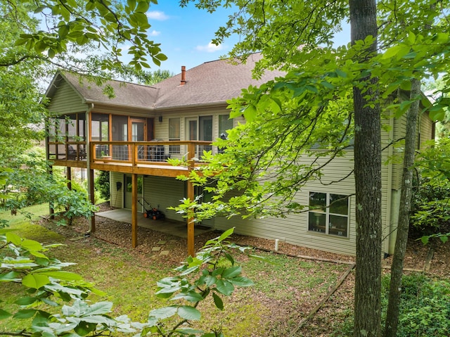 117 Tahlequah Ln, Loudon, TN 37774 - back of house with a sunroom, a wooden deck, and a shingled roof
