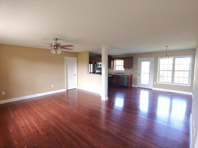 2015 Brights View Ln, Morristown, TN 37814 - unfurnished living room with dark wood-style flooring, a ceiling fan, and a chandelier