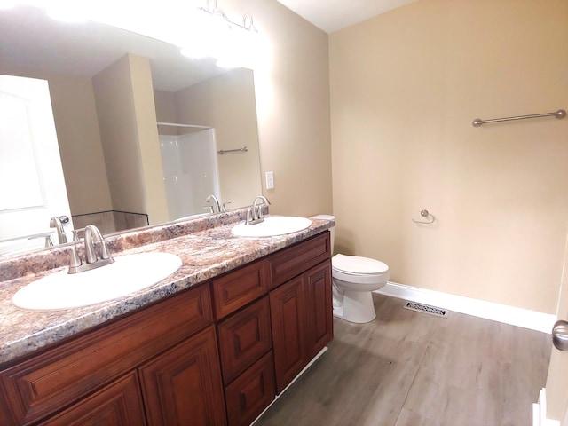2015 Brights View Ln, Morristown, TN 37814 - bathroom featuring a shower, wood finished floors, and double vanity