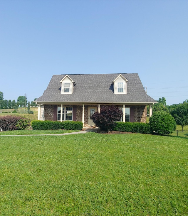 2015 Brights View Ln, Morristown, TN 37814 - new england style home with a front yard, brick siding, and roof with shingles
