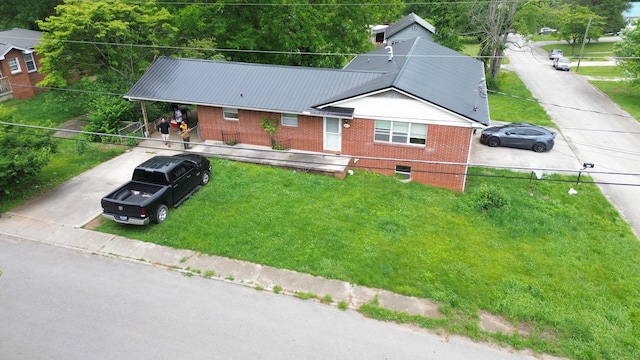 2014 Eastview Ave, Jefferson City, TN 37760 - ranch-style home featuring brick siding, driveway, a front yard, and metal roof